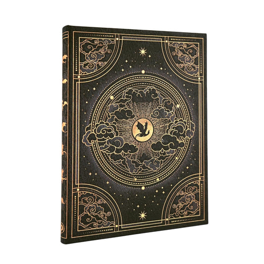 Decorative notebook with gold embossed design on a black background