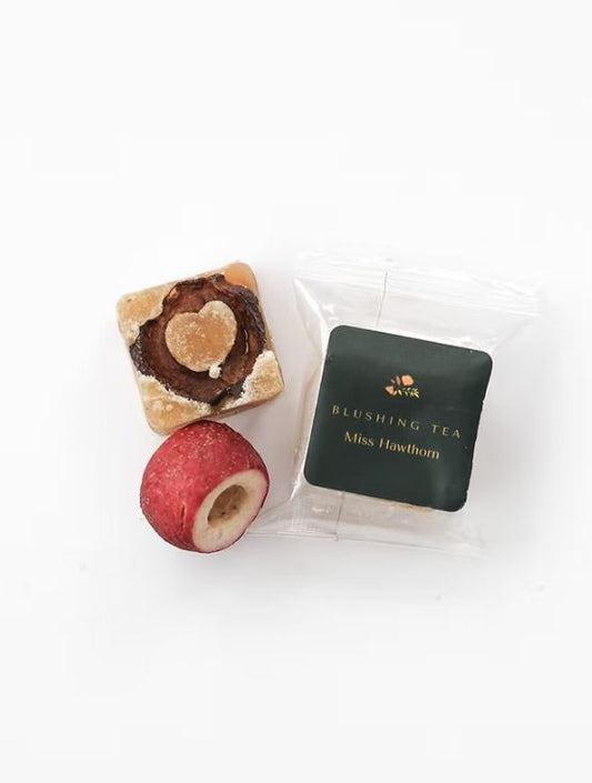Miss Hawthorn honey tea cube shown with packaging.