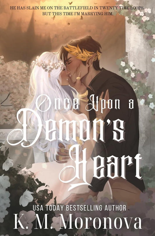 Book cover of 'Once Upon a Demon's Heart' with a couple embracing and text overlay.