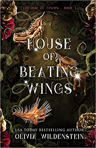 Fantasy novel cover 'House of Beating Wings' by Olivia Wildenstein, styled with themed props.