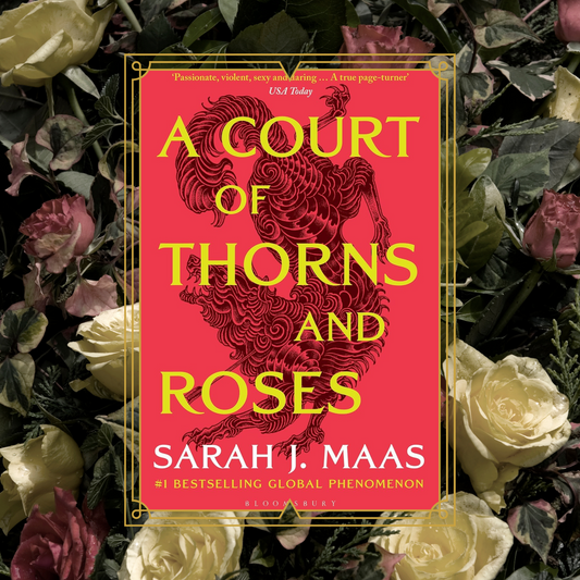 A Court of Thorns And Roses by Sarah J Maas red book cover on a background of roses