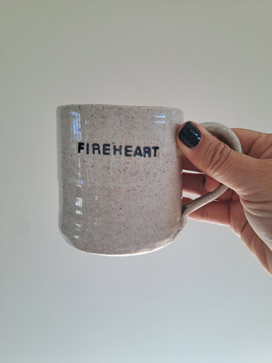 Fireheart mug being held in Steph's hand.