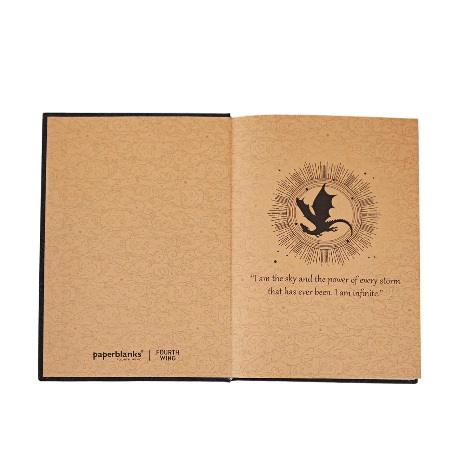 Open notebook with a dragon design and text "I am the sky and the power of every storm that has ever been. I am infinite." on kraft paper, featuring the brand 'paperblanks'.
