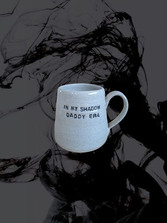 In My Shadow Daddy Era Mug with indented text shown on a shadowy background.