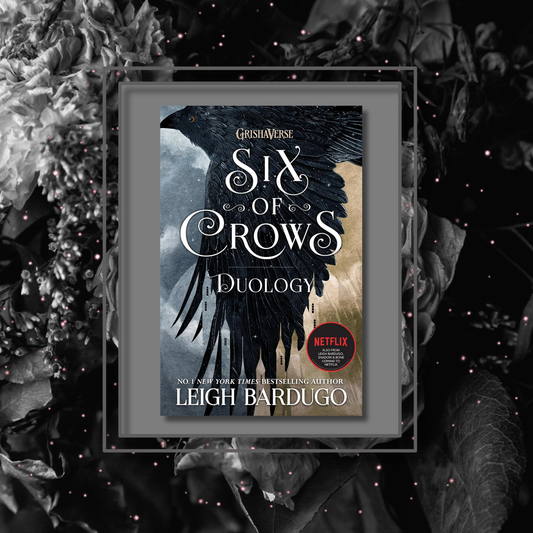 Fantasy novel Six of Crows by Leigh Bardugo, featuring the book cover with a photo background inspired by its artwork.